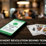 Smartphone showing UPI payment confirmation next to three playing cards on wooden table